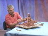 Features sculptor demonstrating how to model a figure in Terracotta using a series of photographs. Perfect for situations where a model is unavailable!